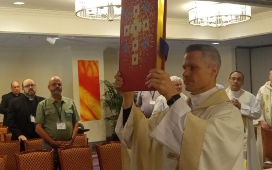 Glenmary Fr. Aaron Wessman celebrates Mass during the inaugural Paulist Summit on Polarization.