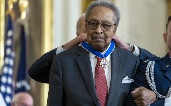 Dr. Clarence B. Jones, a former speechwriter and attorney for Dr. Martin Luther King Jr., receives the Presidential Medal of Freedom from Joe Biden at the White House on May 3 in Washington. (The White House/X)