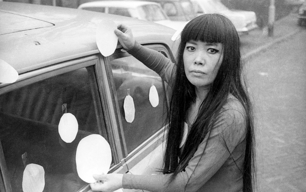 Artist Yayoi Kusama next to her "Dot Car" in 1965 (Courtesy of Magnolia Pictures/Harrie Verstappen)
