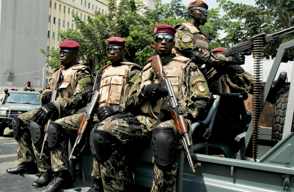 Members of the Ivory Coast presidential guard patrol as they arrive at the port of Abidjan. (CNS/Reuters/Luc Gnago)