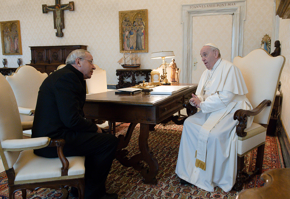 Pope Francis greets Jesuit Fr. Marko Rupnik during a private audience at the Vatican in this Jan. 3, 2022, file photo. Rupnik, whose mosaics decorate chapels in the Vatican, all over Europe, in the United States and Australia, is under restricted ministry after being accused of abusing adult nuns in Slovenia. (CNS/Vatican Media)