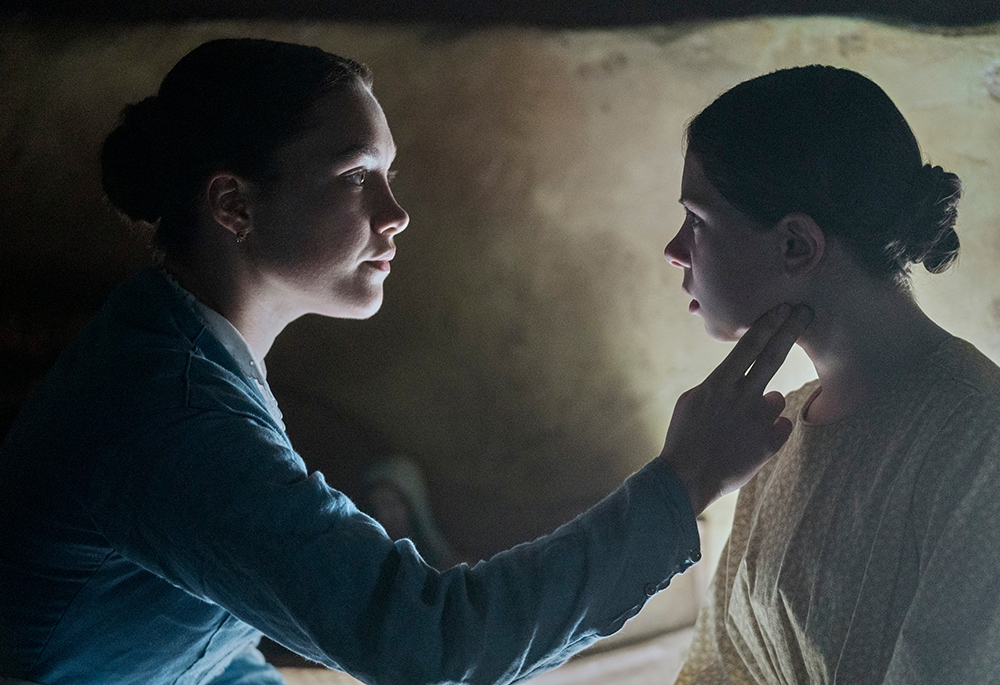 Florence Pugh as Lib Wright and Kíla Lord Cassidy as Anna O'Donnell in "The Wonder." (Aidan Monaghan/Netflix © 2022)