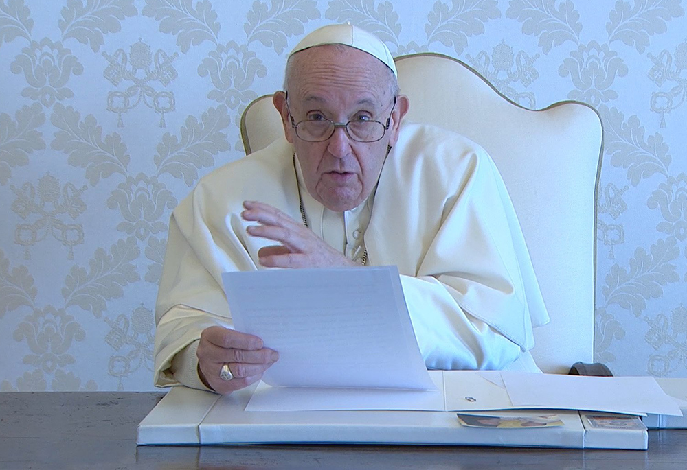 Pope Francis speaks in a video message to an online international conference on "A Politics Rooted in the People" in this still image taken from video released April 15, 2021, by the Holy See Press Office. (CNS/Holy See Press Office)