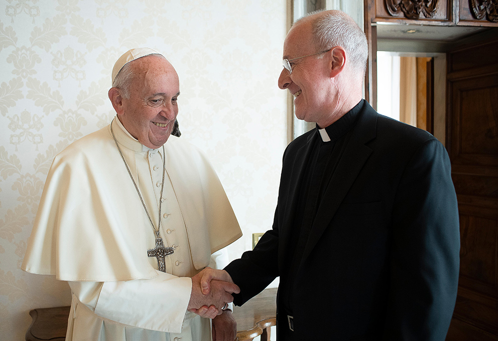 Pope Francis greets Jesuit Fr. James Martin during a private meeting at the Vatican in this Oct. 1, 2019, file photo. In 2021, Martin released a handwritten letter from the pope that commended his LGBT ministry. (CNS/Vatican Media)