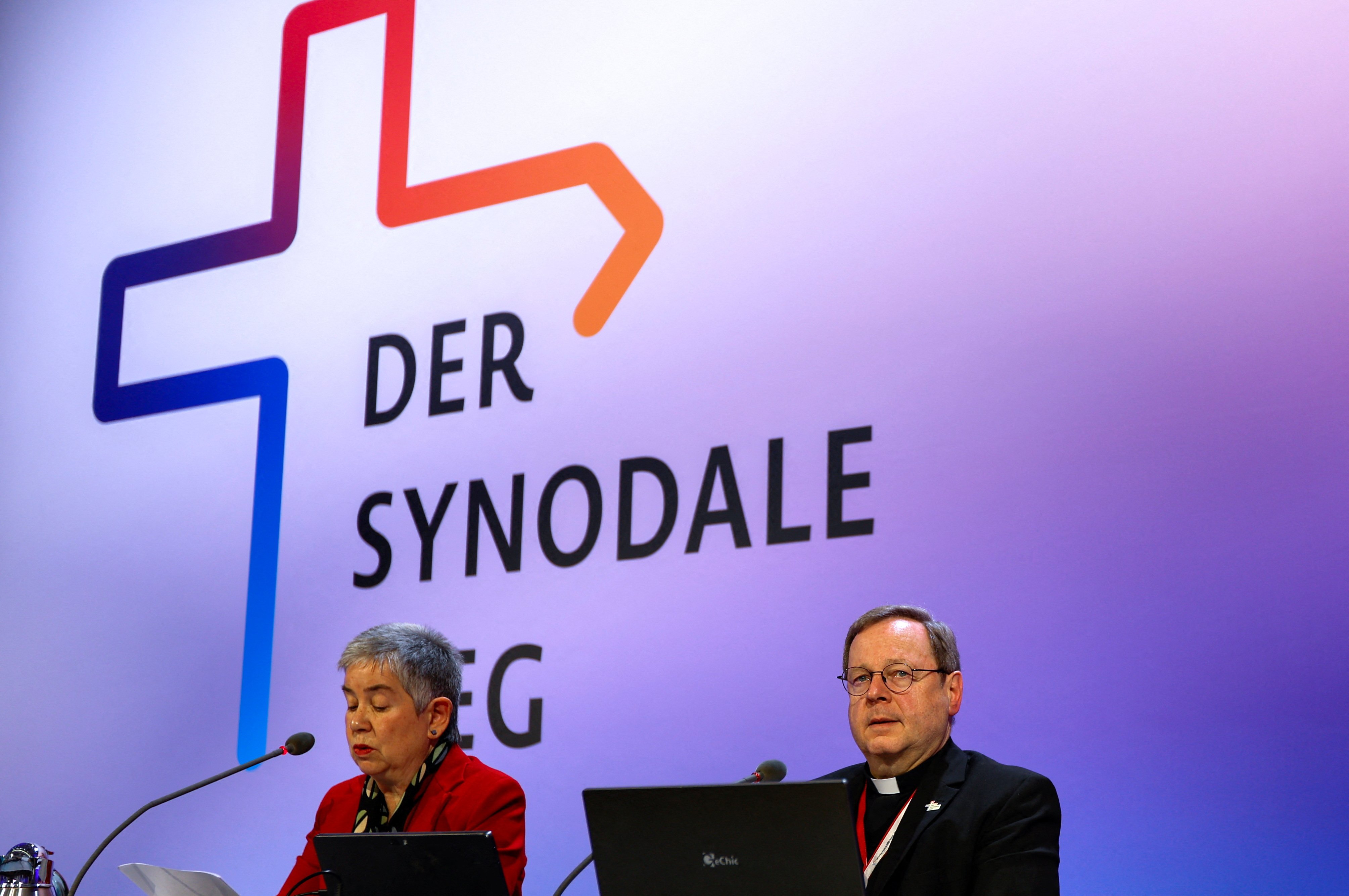 Irme Stetter-Karp, president of the Central Committee of German Catholics and co-chair of the Synodal Path, and Bishop Georg Bätzing, president of the German bishops' conference, sit in front of a screen that says "der Synodale Weg," or "The Synodal Path."attend the fifth synodal assembly in Frankfurt March 9. 