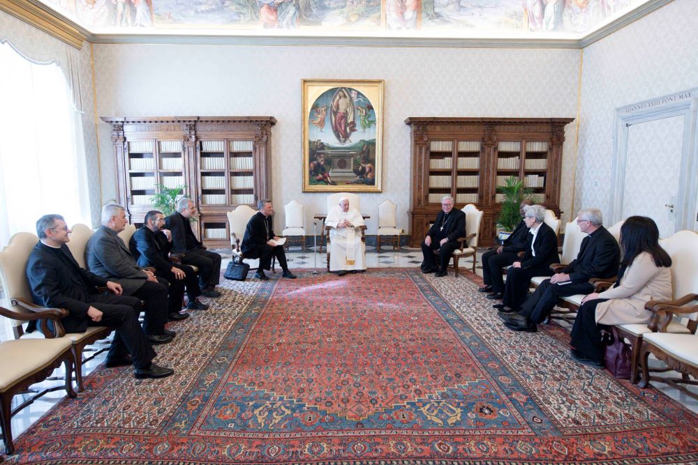 Pope Francis meets with members of the preparatory commission for the general assembly of the Synod of Bishops in the library of the Apostolic Palace at the Vatican March 16, 2023, the day after the synod office announced their appointments. The seven members include: Bishop Daniel E. Flores of Brownsville, Texas; Archbishop Timothy Costelloe of Perth, president of the Australian bishops' conference; and Mercedarian Sister Shizue "Filo" Hirota from Tokyo. (CNS photo/Vatican Media)