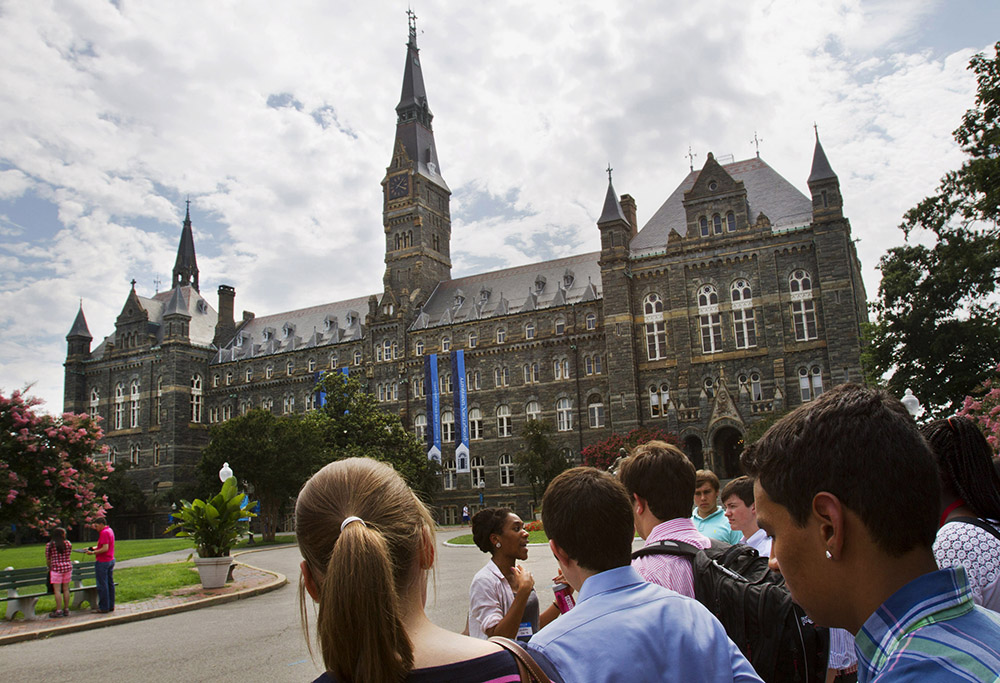 Prospective students tour Georgetown University's campus in Washington, D.C., in July 2013. (AP/Jacquelyn Martin, File)