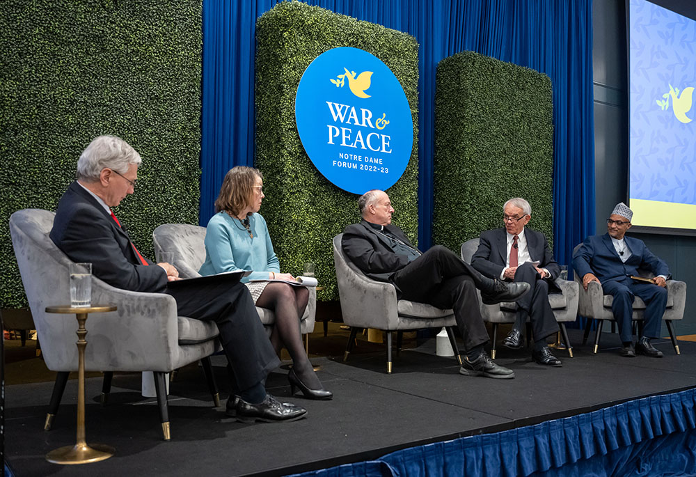 From left: Gerard Powers, Mary Ellen O'Connell, San Diego Cardinal Robert McElroy, Robert Latiff and Rashied Omar talk during the event titled "New and Old Wars, New and Old Challenges to Peace," as part of the Notre Dame Forum on March 1 at the University of Notre Dame in Indiana. (University of Notre Dame/Barbara Johnston)
