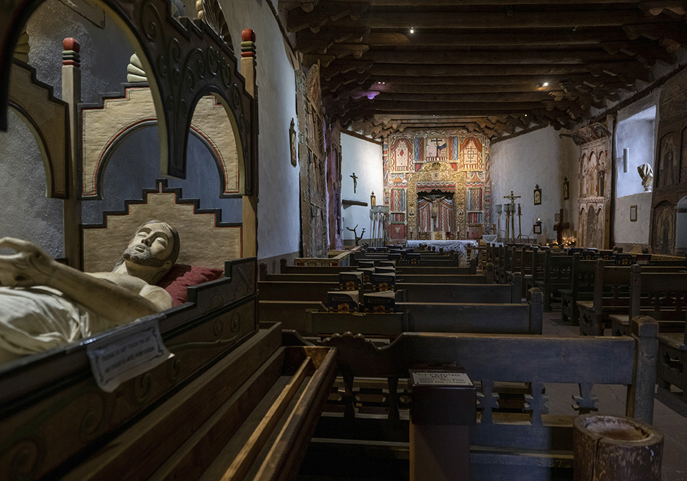 An interior view of Santuario de Chimayo, April 14 in Chimayo, New Mexico. An estimated 500 Catholic mission churches remain in northern New Mexico, where the Rocky Mountains taper off into desert mesas to the west and endless plains to the east. (AP photo/Roberto E. Rosales)