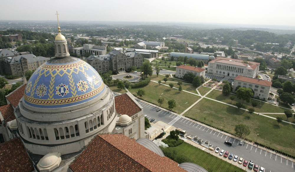 The blue and yellow dome of The Catholic University of America's dome is seen in an aerial photograph of the campus