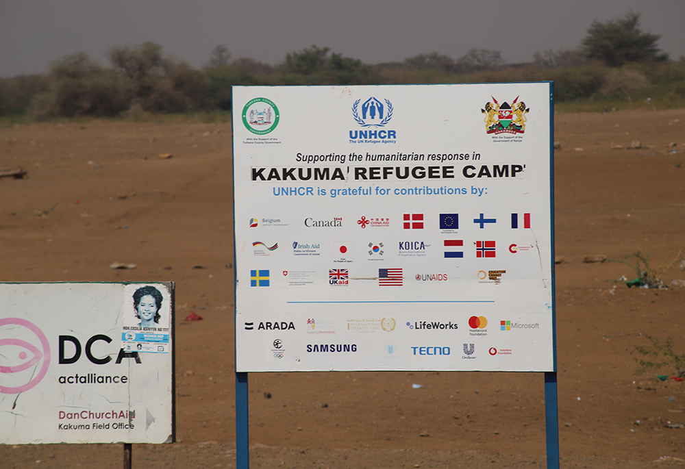 A signpost marks the Kakuma Refugee Camp, located in Kenya's northwestern region. The camp is home to more than 200,000 refugees, mainly from South Sudan, Sudan, Somalia, the Democratic Republic of the Congo, Burundi, Ethiopia, and Uganda. Among them, there are over 600 self-identified LGBTQ members. (NCR photo/Doreen Ajiambo)