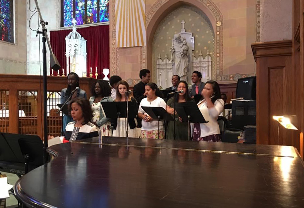 Jennifer Fairweather accompanies the St. Ignatius of Loyola youth choir on keyboard at Easter. Fairweather began to play piano with the Loyola choir when she was about 10 years old. (Courtesy of Jennifer Fairweather)