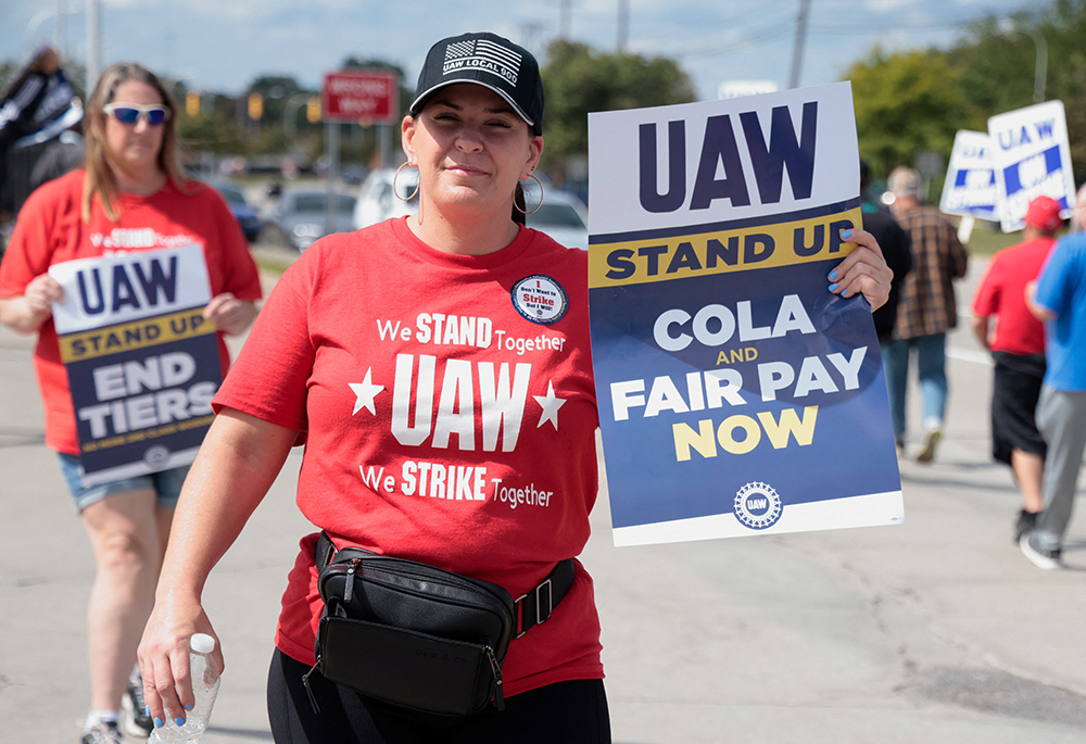 Striking United Auto Workers walk the picket line outside the Ford Michigan Assembly Plant in Wayne, Michigan, Sept. 15. (OSV News/Reuters/Rebecca Cook)