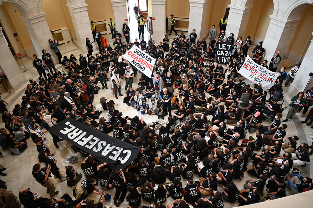 Hundreds of demonstrators calling for a cease-fire in Gaza gathered in the U.S. Capitol's Cannon House Office Building rotunda on Oct. 18. The group was primarily organized by Jewish Voice for Peace. (RNS/Jack Jenkins)