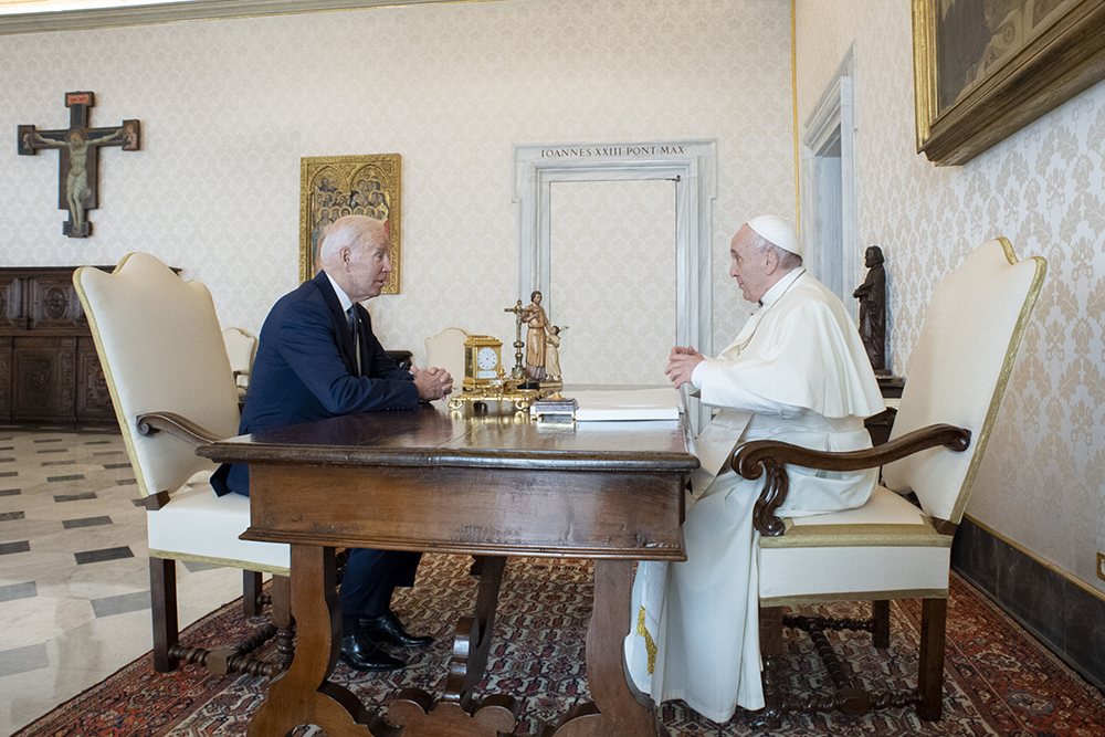 President Joe Biden, left, talks with Pope Francis as they meet at the Vatican, Oct. 29, 2021. (Photo by Vatican Media)