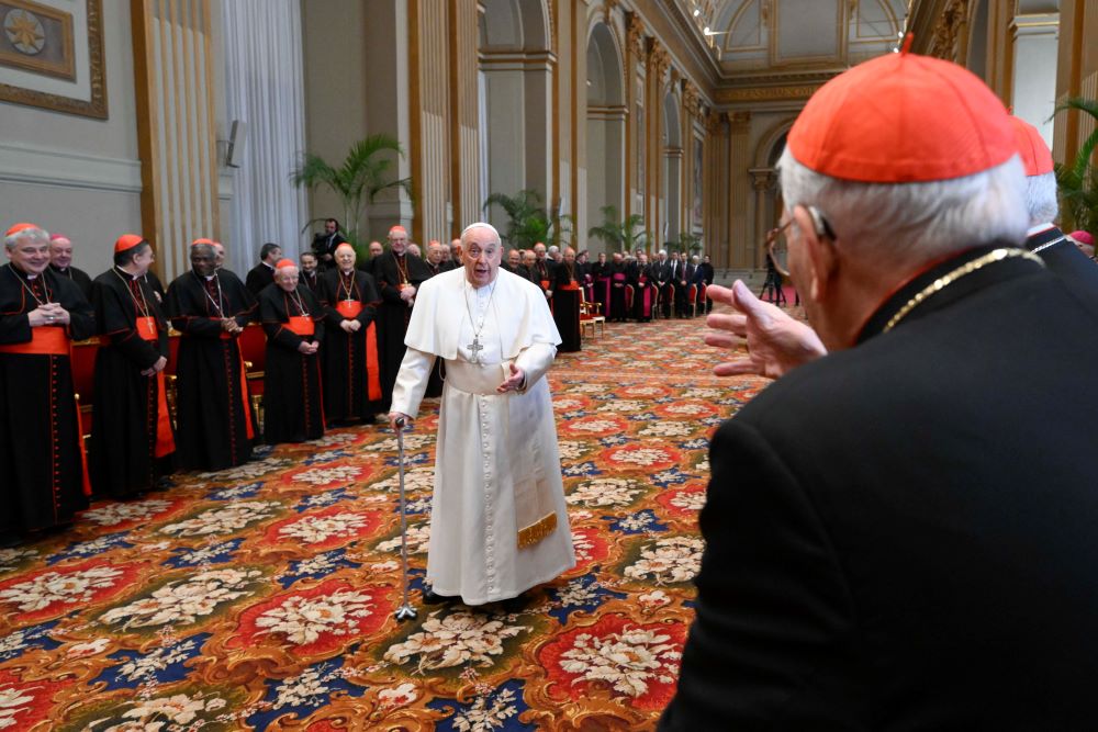  Pope Francis smiles at Cardinal Giovanni Battista Re, dean of the College of Cardinals, as he arrives in the Vatican's Hall of Blessings Dec. 21 to give his Christmas greetings to cardinals and top officials of the Roman Curia. (CNS/Vatican Media)