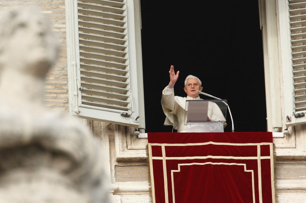 Pope Benedict waves from Vatican window. 