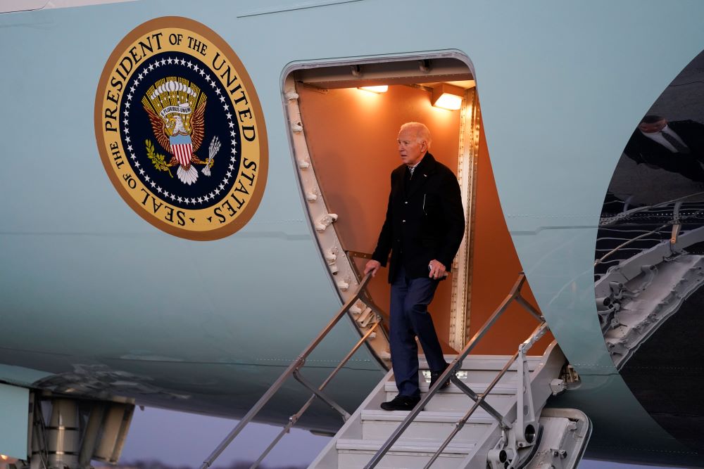 President Joe Biden walks down the steps of Air Force One as he arrives Andrews Air Force Base after a trip to Milwaukee to deliver remarks on his economic agenda Dec. 20, 2023, at Andrews Air Force Base, Maryland. (AP/Evan Vucci)