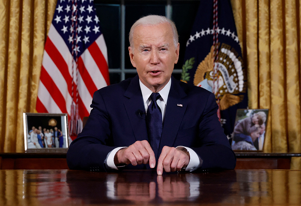 U.S. President Joe Biden delivers a prime-time address to the nation about his approaches to the conflict between Israel and Hamas, humanitarian assistance in Gaza and continued support for Ukraine in their war with Russia, from the Oval Office of the White House Oct. 19, 2023, in Washington. (OSV News/Reuters/Jonathan Ernst)