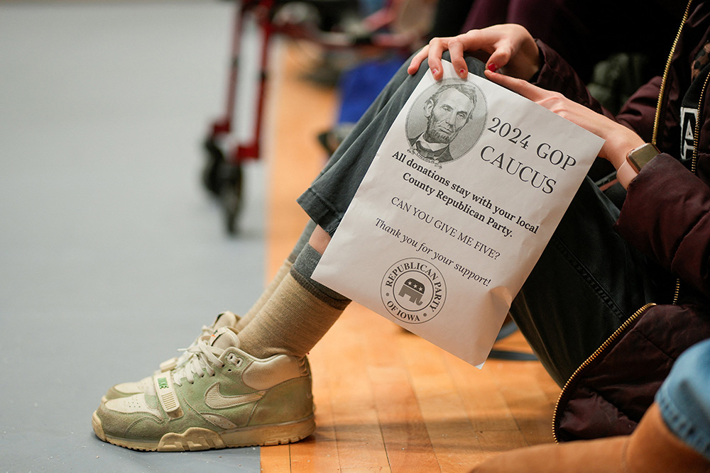 A person holds a donation flyer at a caucus site to choose a Republican presidential candidate at Fellows Elementary School in Ames, Iowa, Jan. 15, 2024. (OSV News/Reuters/Cheney Orr)