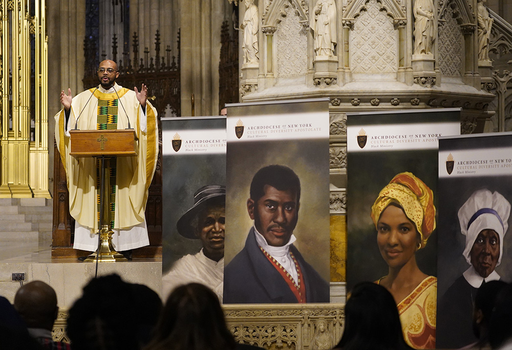 Fr. Kareem Smith addresses the congregation during the Archdiocese of New York's annual Black History Month Mass at St. Patrick's Cathedral Feb. 4 in New York City. The liturgy also marked the National Day of Prayer for the African American and African Family. At the front of the altar are images of four of six U.S. Black Catholics up for sainthood: Julia Greeley, left, Pierre Toussaint, Sr. Thea Bowman and Mother Mary Elizabeth Lange. (OSV News/Gregory A. Shemitz)