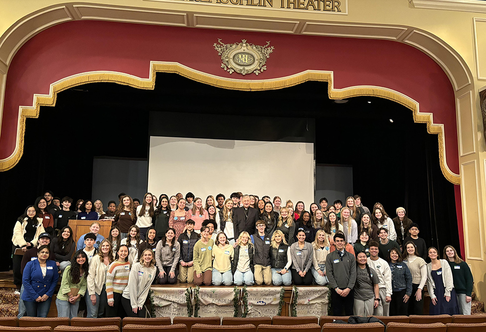 Participants of the third annual Catholic Youth Climate Summit in Chicago gather for a photo with Cardinal Blase Cupich (center), Feb. 25 at St. Ignatius College Prep. (Courtesy of Catholic Climate Covenant)