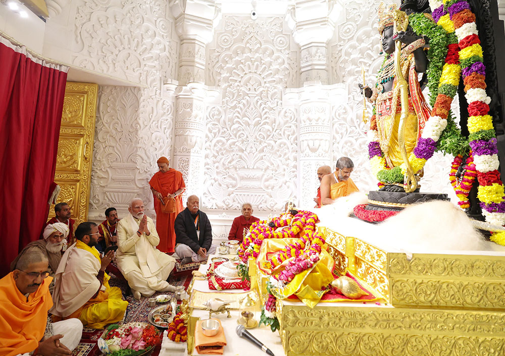 Indian Prime Minister Narendra Modi, in white, prays during the dedication of a large Hindu shrine in the city of Ayodhya Jan. 22. It was built on top of the ruins of a 16th-century mosque that was destroyed by Hindu mobs in 1992. (Wikimedia Commons/Government of India)