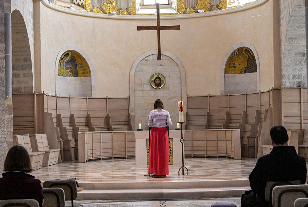 A German theology student reads the psalms during a day of prayers and fasting for peace in the Dormition Abbey on Mount Zion in the Old City of Jerusalem, Oct. 17, 2023. (OSV News/Debbie Hill)