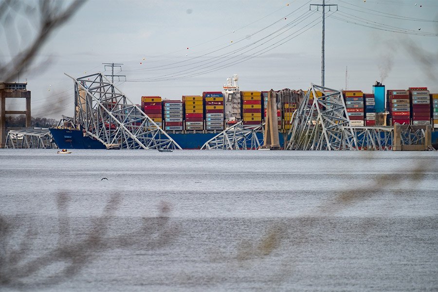 A section of the Francis Scott Key Bridge in Baltimore is seen collapsed into the Patapsco River March 26, following a main support column being struck in the early morning hours by the container ship Dali as it was leaving the Port of Baltimore. (OSV News/Catholic Review/Kevin J. Parks)