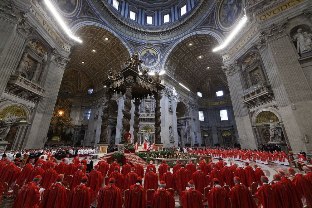 In this file photo, before entering the conclave, cardinals concelebrate Mass for the election of the Roman pontiff in St. Peter's Basilica at the Vatican on March 12, 2013. 