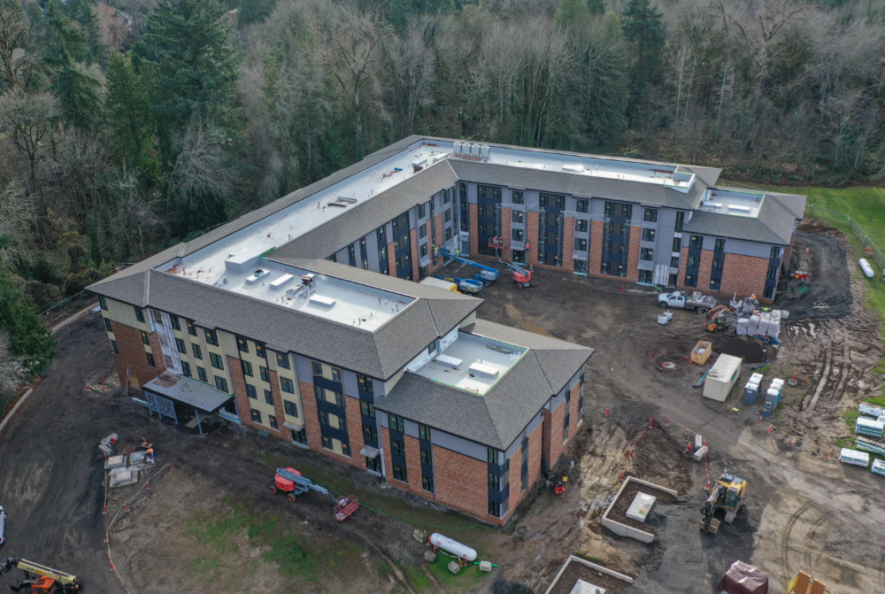 The Mercy Greenbrae project can be seen under construction on the campus of the former Marylhurst University. Through a partnership of the Sisters of the Holy Names of Jesus and Mary and Mercy Housing, 100 units of affordable housing are being built where two college dorms once stood. 