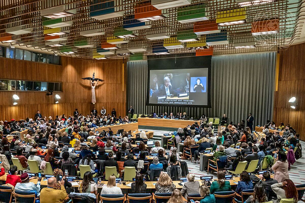A wide view of a town hall meeting on March 13 with members of civil society during the 68th session of the Commission on the Status of Women at the United Nations in New York. On the screen is U.N. Secretary-General António Guterres. (U.N. photo/Mark Garten)