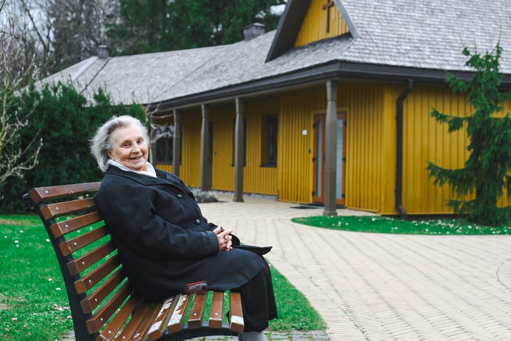Sr. Nijole Sadunaite sits at the entrance to the Congregation of the Maids of the Most Holy Virgin Mary convent in the Lithuanian capital of Vilnius during an April 2023 interview. 