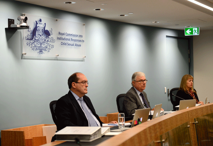 On Dec. 9 in Sydney, the Royal Commission Into Institutional Responses to Child Sexual Abuse holds a public hearing, chaired by Judge Peter McClellan (center), on the the Catholic church's Towards Healing national protocol. (Pool/Jeremy Piper)