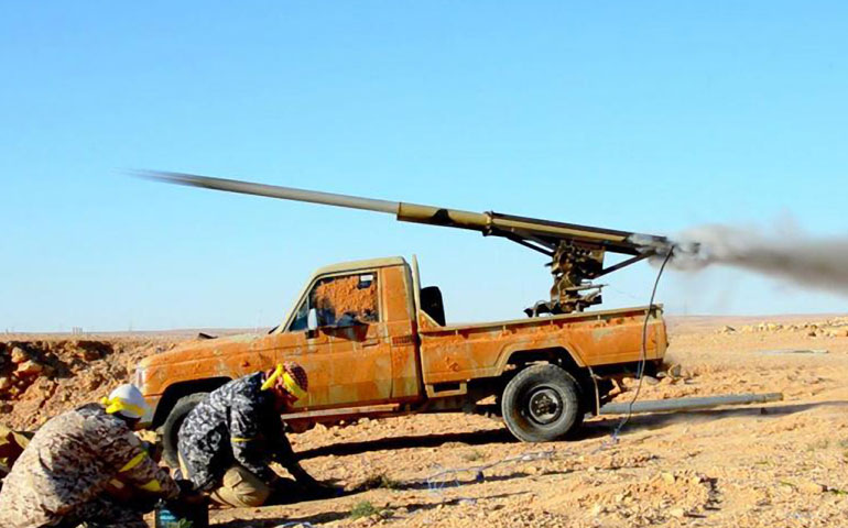 An Islamic State propaganda photo shows militants launching attacks on an oil storage facility Jan. 4 in Sidra, Libya. (Newscom/Zuma Press/Dabiq)