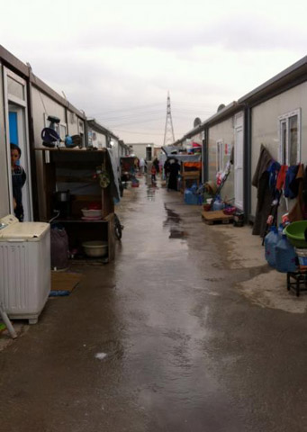 A row of 'caravan' dwellings at 128 Camp, where displaced persons were living in January when three U.S. Dominican Sisters went to visit. The shelters keep out the elements better than tents but provide little privacy. (Marcelline Koch)