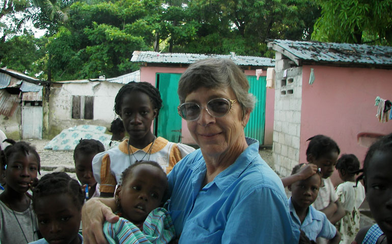 Loretto co-member Barbara Wander works with needy children in Ti Riviere, Haiti.