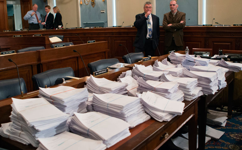 Stacks of paperwork await members of the House Agriculture Committee on Capitol Hill in Washington May 15, as it met to consider proposals to the 2013 farm bill. (AP/J. Scott Applewhite)