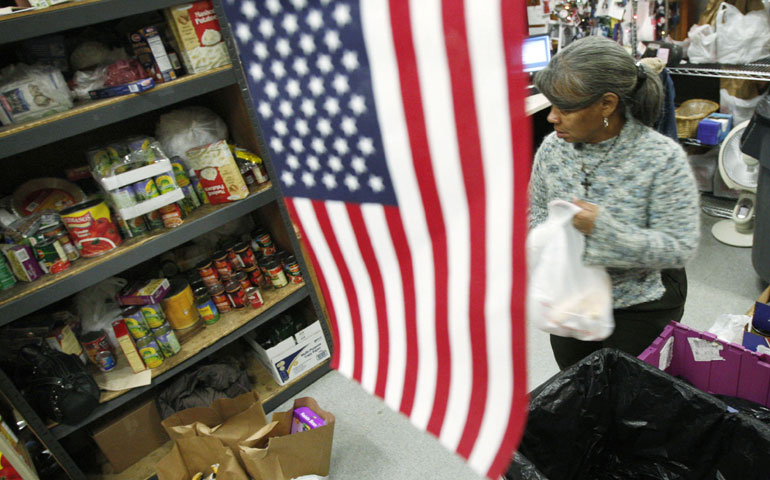 Volunteer Linda Robb fills up a bag with food at the Bread for the City food pantry in Washington in 2008. (Newscom/Reuters/Jim Young)