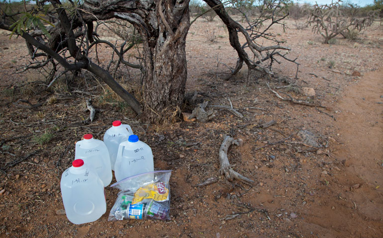 Water and food for migrants from Mexico that were left along a desert trail by volunteers with No More Deaths are seen in late January 2012 in Arivaca Junction, Ariz. (CNS/Jim West)