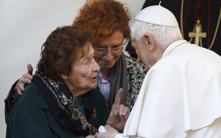 Pope Benedict XVI talks with Enrichetta Vitali, 91, during a visit Monday to a home for the elderly run by the Sant'Egidio Community in Rome. (CNS/Paul Haring)