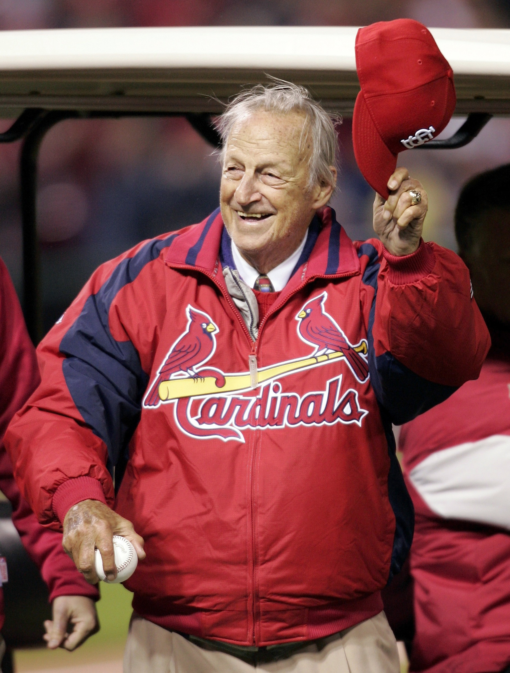 St. Louis Cardinal baseball Hall of Famer Stan Musial tips his hat to the crowd before he throws out the ceremonial first pitch prior to the start of 2006 World Series in St Louis. Musial, a Catholic, died Jan. 19 at age 92. He was awarded the Medal of F reedom in 2011 by President Barack Obama and over the years was supportive of charities of the Archdiocese of St. Louis. (CNS photo/John Sommers II, Reuters)