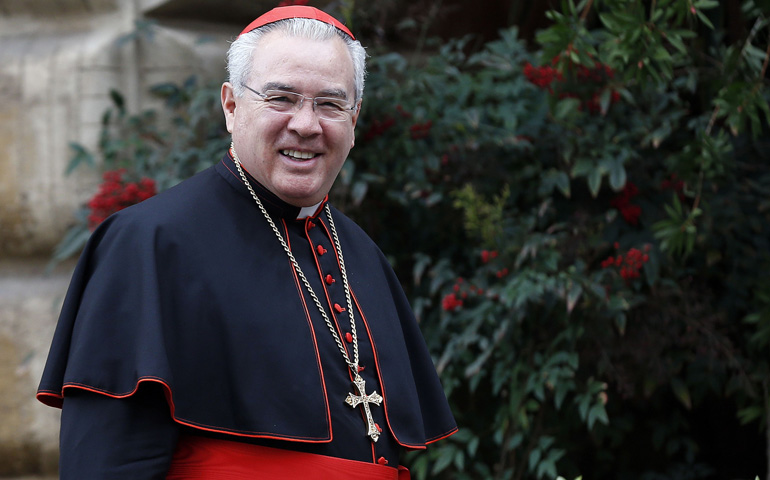 Cardinal Francisco Robles Ortega of Guadalajara, Mexico, smiles as he arrives March 7 for the fourth day of general congregation meetings in the synod hall at the Vatican. (CNS/Reuters/Alessandro Bianchi)