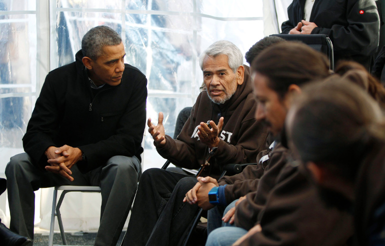 U.S. President Barack Obama listens to hunger striker Eliseo Medina during a Nov. 29, 2013 visit with immigration reform advocates in their tent on the National Mall in Washington.  (CNS/Reuters/Jason Reed) 