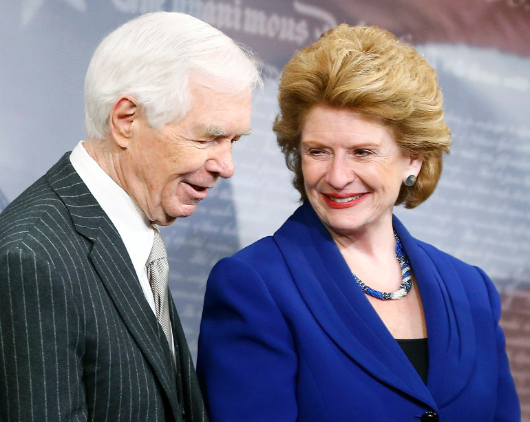 Sen. Debbie Stabenow, D-Mich., chairwoman of the Senate Agriculture Committee, smiles with ranking member Sen. Thad Cochrane, R-Miss., at a news conference held Feb. 4 at the U.S. Capitol after the final passage of the farm bill in Washington. (CNS/Reuters/Jonathan Ernst)