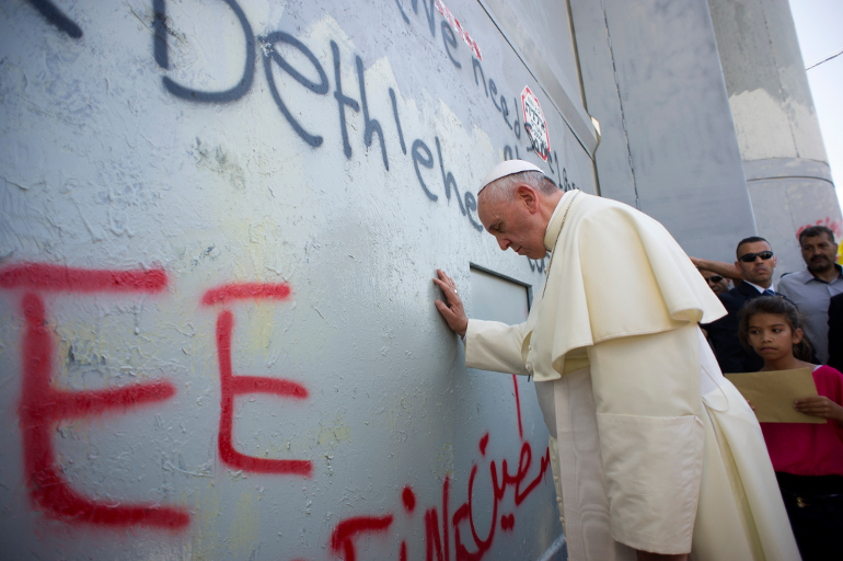 Pope Francis prays for peace in front of the Israeli security wall in Bethlehem, West Bank, May 25. (CNS/L'Osservatore Romano)