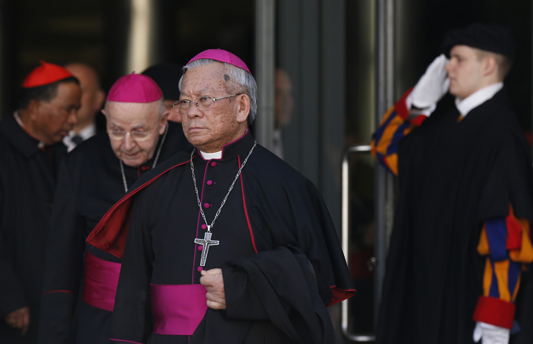 Cardinal-designate Pierre Nguyen Van Nhon of Hanoi, Vietnam, leaves a meeting with Pope Francis in the synod hall at the Vatican Feb. 12. The pope, cardinals and cardinals-designate were meeting for two days to discuss the reform of the Roman Curia in advance of a Feb. 14 consistory. The pope will create 20 new cardinals at the consistory. (CNS photo/Paul Haring)