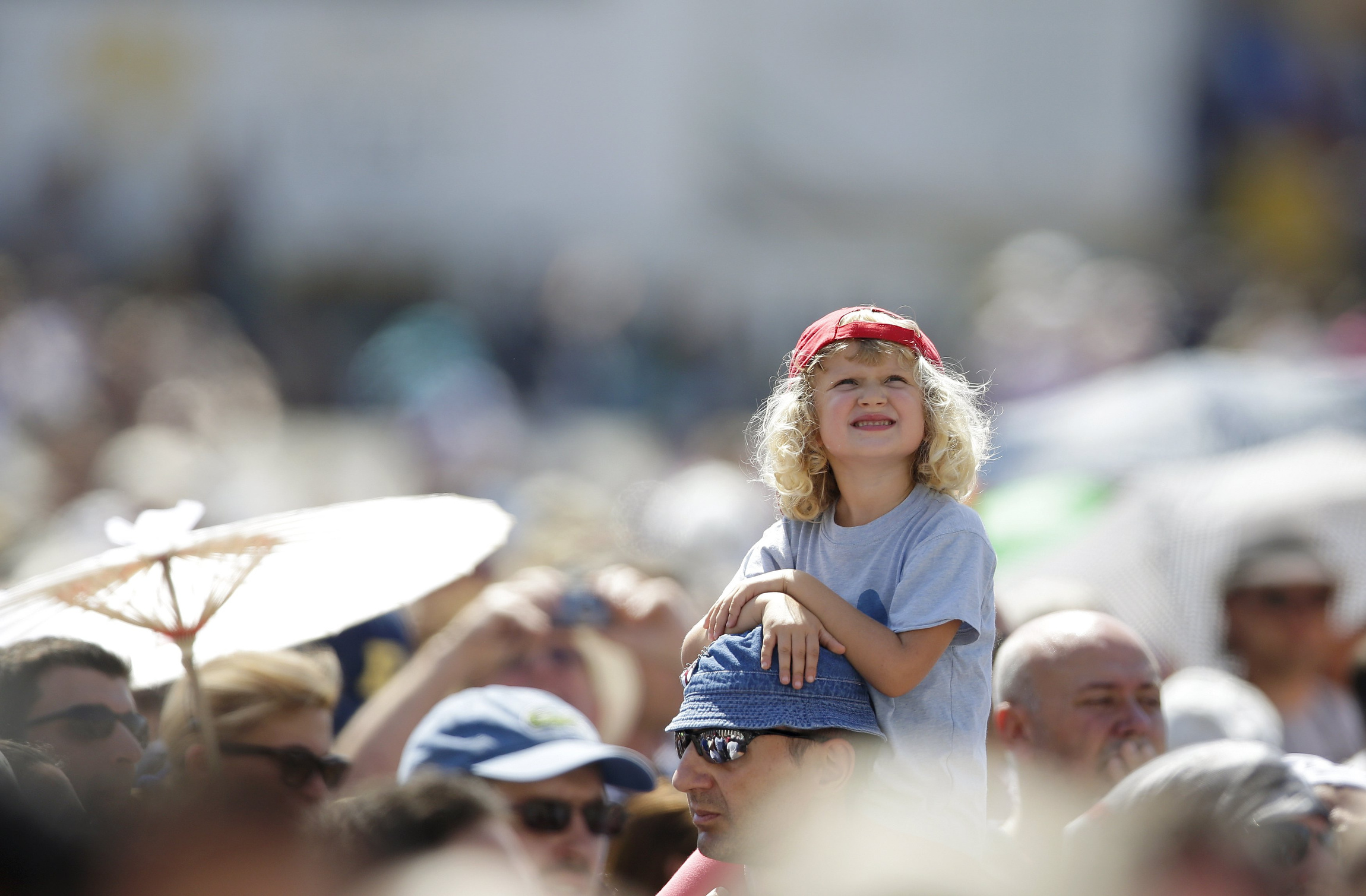 A child watches as Pope Francis leads the Angelus from the window of his studio overlooking St. Peter's Square at the Vatican Aug. 30. (CNS/Max Rossi, Reuters)