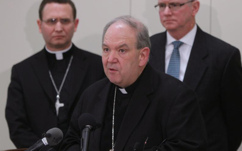 Archbishop Bernard Hebda speaks at a news conference following the Dec. 18 filing of a settlement agreement between the St. Paul and Minneapolis archdiocese and the Ramsey County Attorney's Office. (CNS/Dave Hrbacek, The Catholic Spirit)