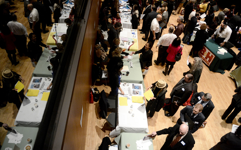 Jobseekers line up to meet with a prospective employer during a 2013 job fair in New York City. (CNS/Andrew Gombert, EPA)
